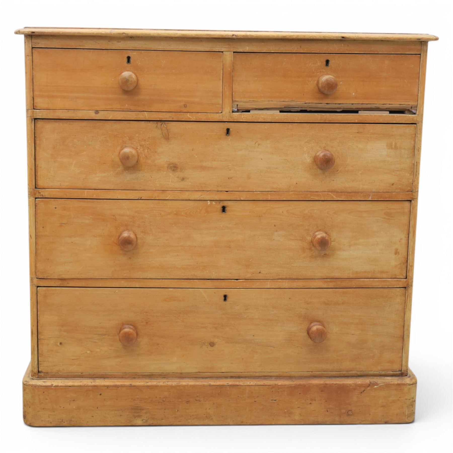 Victorian waxed pine chest, fitted with two short and three long drawers, turned wooden handles, raised on plinth base