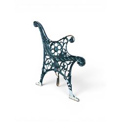 Pair of ornate painted cast iron bench ends, painted in green