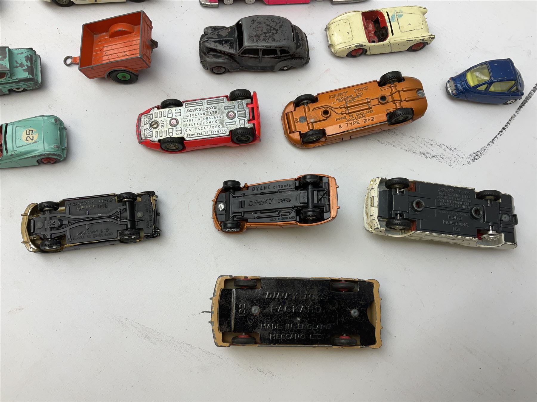 Dinky - twenty-five unboxed and playworn die-cast models including Lady Penelope FAB1, Caravan, Ford Sedan, Triumph TR2, Packard, Austin Somerset, Devon, Healey and Seven Countryman etc (25)