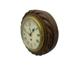 Edwardian - 8-day ships bulkhead clock and an Aneroid barometer.
In matching circular oak cases with carved rope twist bezels.
Clock with a painted metal dial, Roman numerals, minute track and steel spade hands, small seconds hand and platform regulation. Case 9