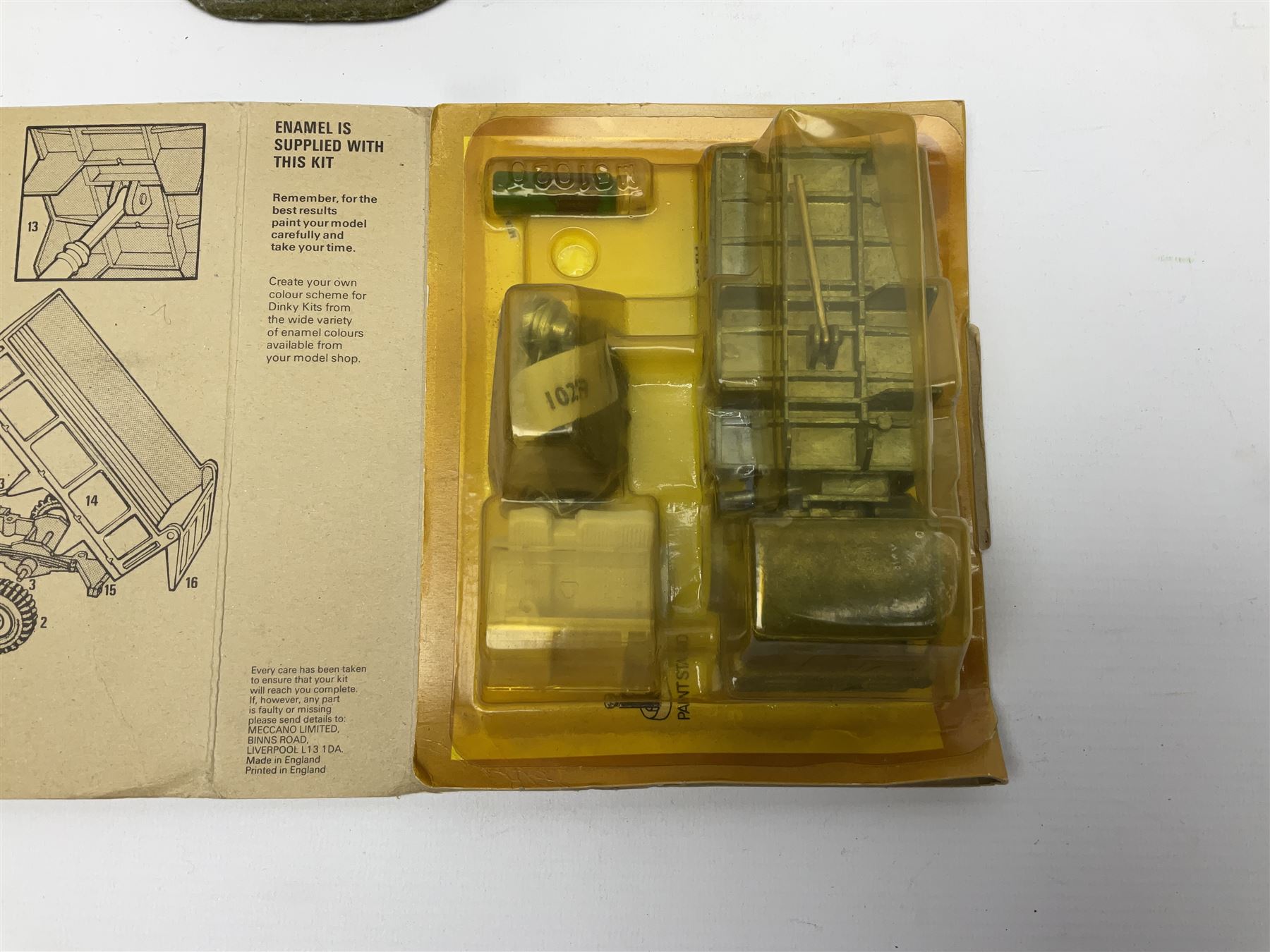 Dinky Kit No.1029 Ford D800 Tipper Truck in unopened original packaging; American Singer child's sewing machine; Spong's table mounting Bean Slicer No.632; and two wall mounting wooden die-cast model open display racks (5)