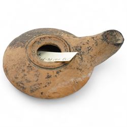 A group of five ancient terracotta oil lamps - Eastern Mediterranean (c.2nd century BC-1st century AD),
comprising a black-slipped Greek lamp (c.2nd-1st century BC) with a rounded body and narrow nozzle; a Herodian lamp (c.25 BC-75 AD) of compact form with central fill hole and pinched wick aperture; a Herodian lamp (c.1st century AD) with central raised disc and dotted ring motif; a Roman/Herodian hybrid lamp (c.50 BC-50 AD) with pronounced rounded shoulders and recessed top; and a further Roman/Herodian lamp (c.50 BC-50 AD) retaining an ancient carbonised wick fragment in the nozzle.
Provenance: By the vendor’s repute, acquired/collected in the Middle East (Dead Sea area/Syria) in the 1960s