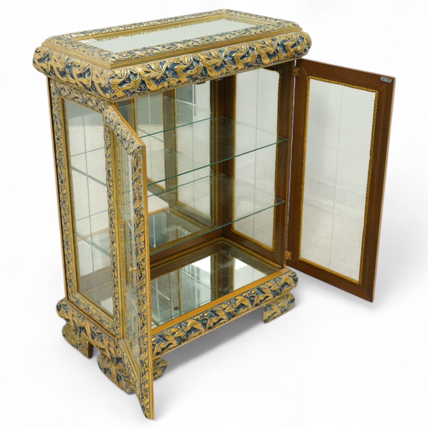 Astoria Grand, Constance dining cabinet, mirrored top, carved wood and gold painted, two glass panelled doors with glass shelves on bracket-type feet