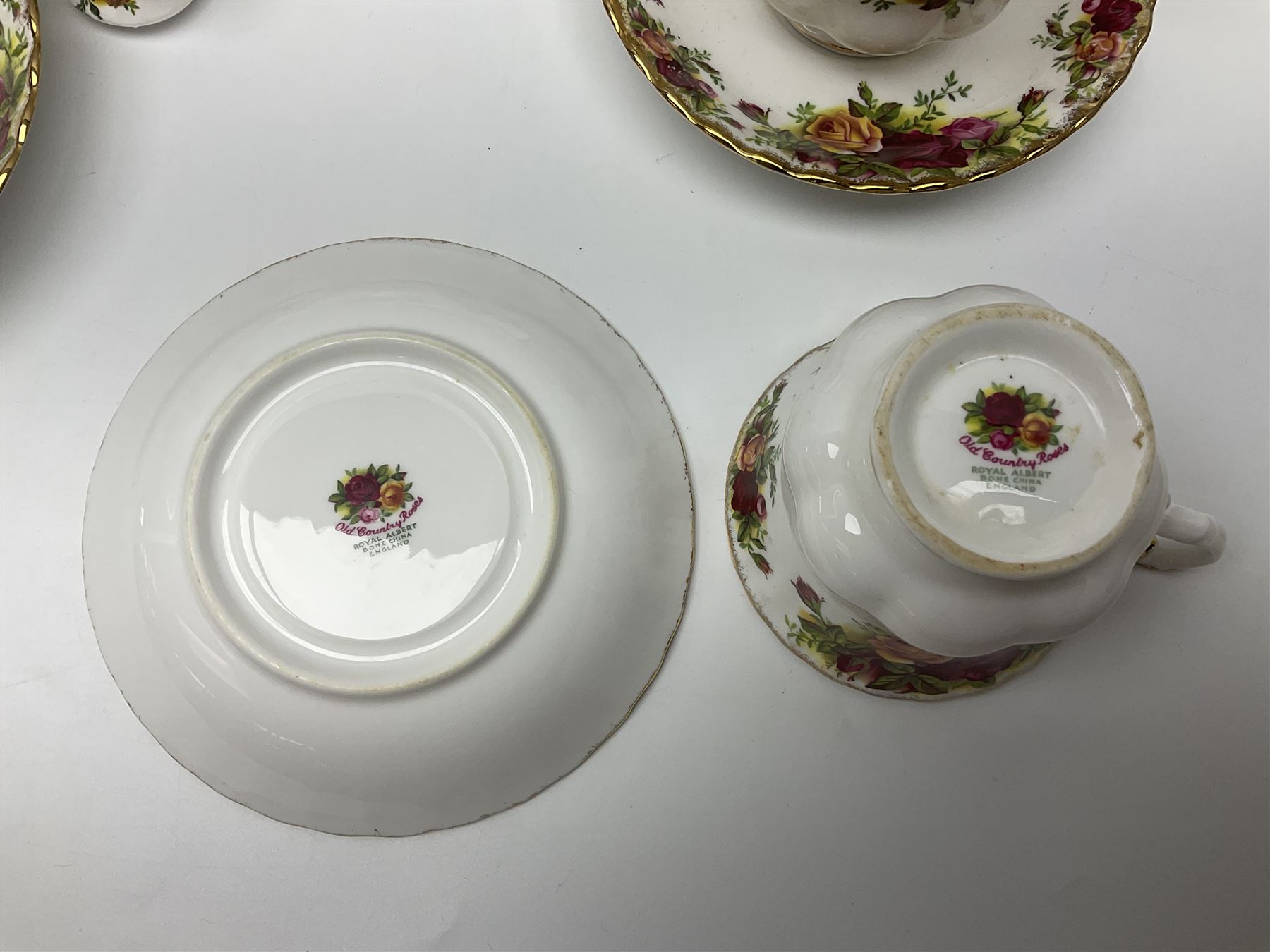Royal Albert Country Roses pattern part tea and dinner service, to include teapot, four cups and saucers, four dessert plates, cake plate etc, (41)
