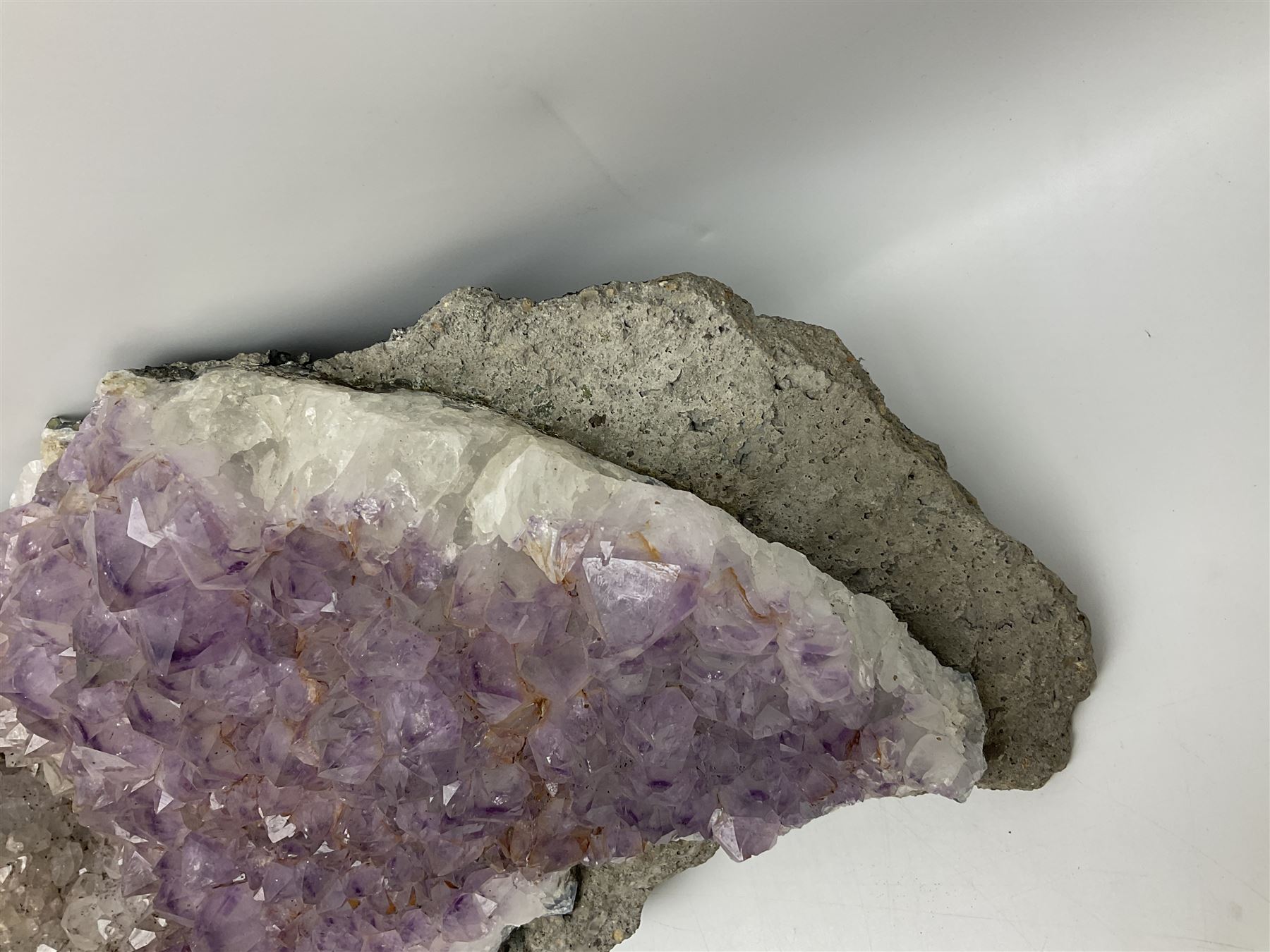 Amethyst crystal geode cluster, with well-defined crystals of various sizes, H13cm, L46cm