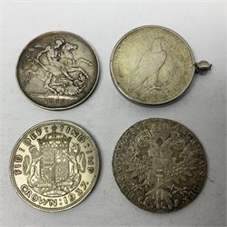 Four silver World coins comprising Queen Victoria 1889 crown, King George VI 1937 crown, Marie Thaler 1780 restrike, and mounted United States of America 1928 peace dollar 