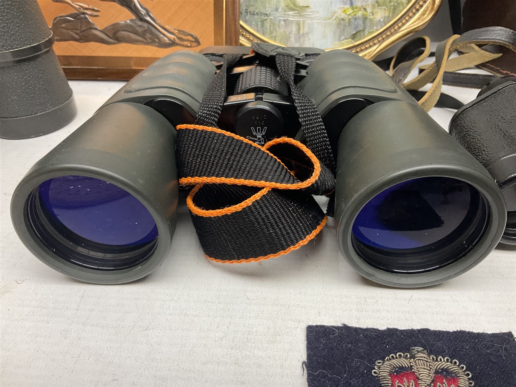 Three pairs of binoculars to include Enbeeco Concord and Bresser, Palestine police patch, framed pictures etc