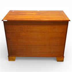 Late 20th century pair of yew wood chests of drawers, each with rectangular tops above two short over two long drawers, cockbeaded drawer fronts fitted with brass swan neck handles, raised on bracket feet