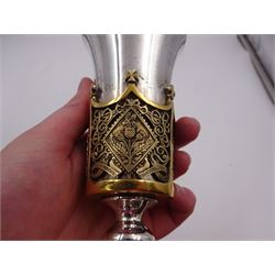 Modern limited edition silver Westminster Abbey Royal Wedding goblet, commemorating the marriage of HRH Prince Andrew and Miss Sarah Ferguson on the 23rd of July 1986, designed by Hector Miller for Aurum, the tapering cylindrical bowl with gilt interior and parcel gilt pierced band to base depicting the Royal Arms, upon knopped stem and circular stepped foot with floral parcel gilt rim, no. 483/750,  hallmarked Hector Miller, London 1986, H17cm