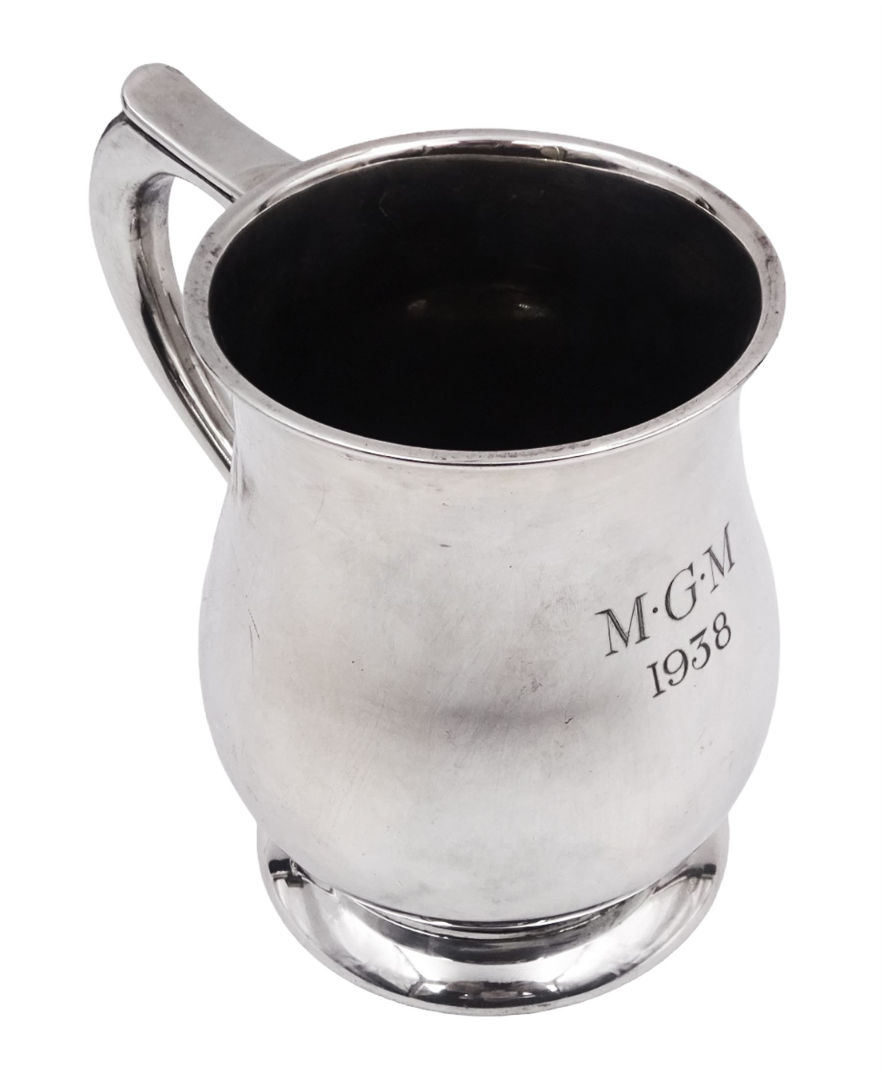 1930s silver tankard, of baluster form, with personalised engraving and C scroll handle, upon spreading circular foot, hallmarked Mappin & Webb Ltd, Sheffield 1938