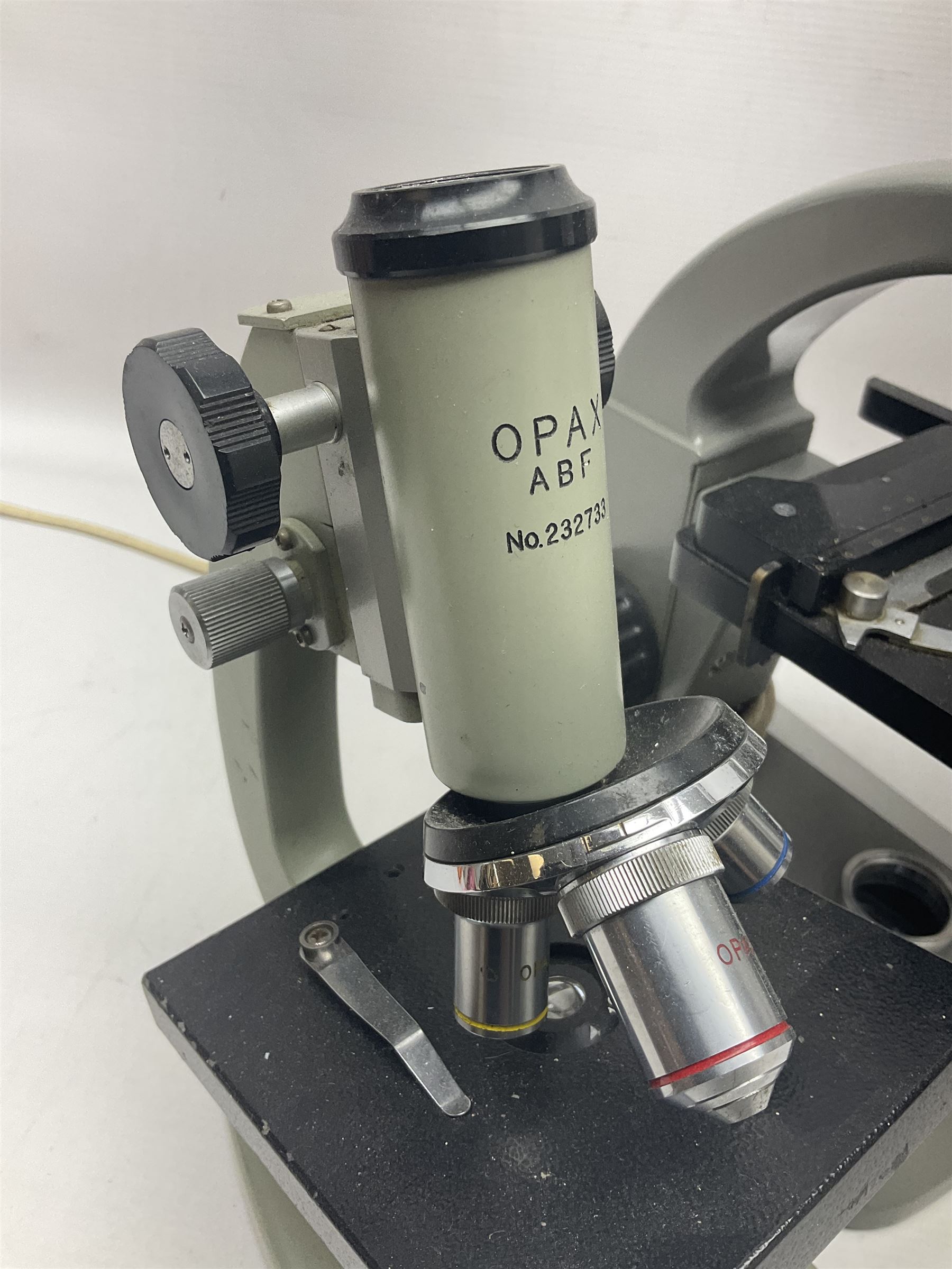 Four microscopes, comprising C Baker London Vickers, Back Diamax no 40956, Opax ABF no 232733 and one other 