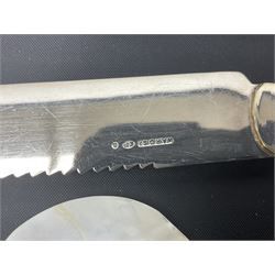 Mother of Pearl handled cutlery, with silver ferrules, comprising six fish knives and forks and six fruit knives and forks, the ferrules hallmarked Yates Brothers, Sheffield 1905, together with silver plated Edwardian three piece tea service and other flatware 