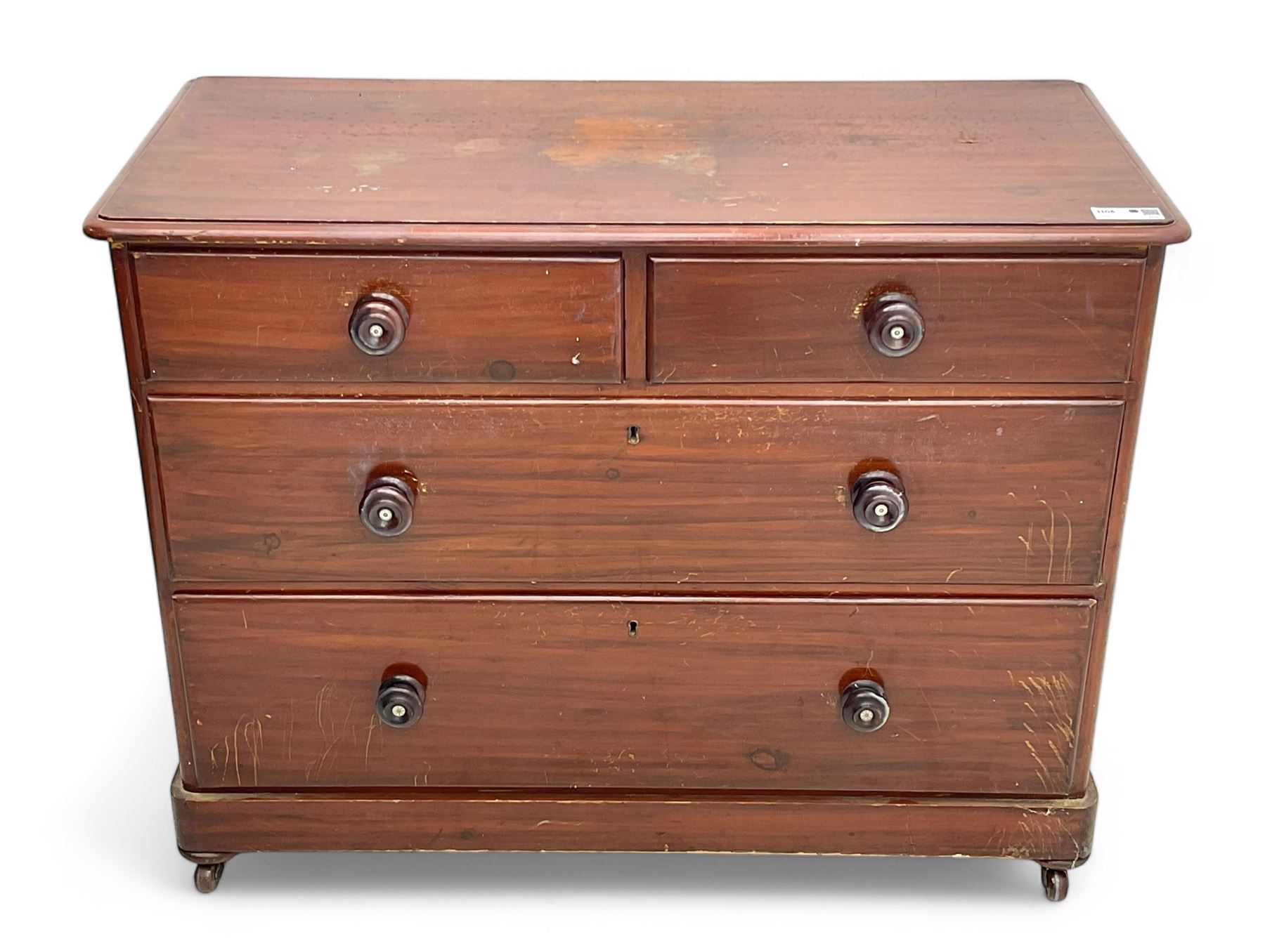 Victorian 19th century stained pine chest of drawers, rectangular top above two short and three long drawers with turned wooden handles, raised on bun feet with castors.
