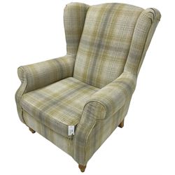 Next Home - 'Sherlock' hardwood framed wingback armchair, upholstered in pale green checkered fabric, on turned front feet