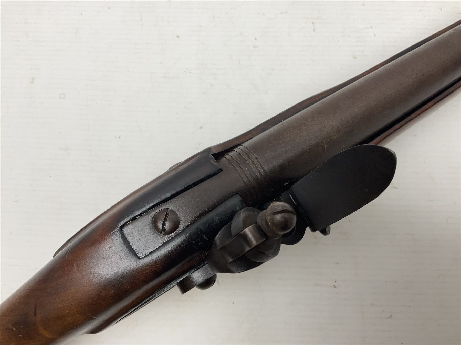 Modern non-firing reproduction Tower flintlock pistol marked with crowned GR and Tower to the lock, brass skull crusher butt and fittings L40cm overall; another Indian/Moorish reproduction flintlock pistol with mother-of-pearl inlay; and a modern die-cast replica Colt style revolver (3)