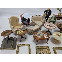 Dolls house furniture, including sofa, chairs, foot stools, fireplace, sideboards, five figures, mirrors, paintings and accessories