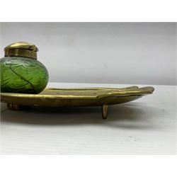 Art Nouveau Geschutzt brass desk stand, with stylised whiplash relief decoration, with removable Loetz style green glass inkwell, stamped to the base, H8cm