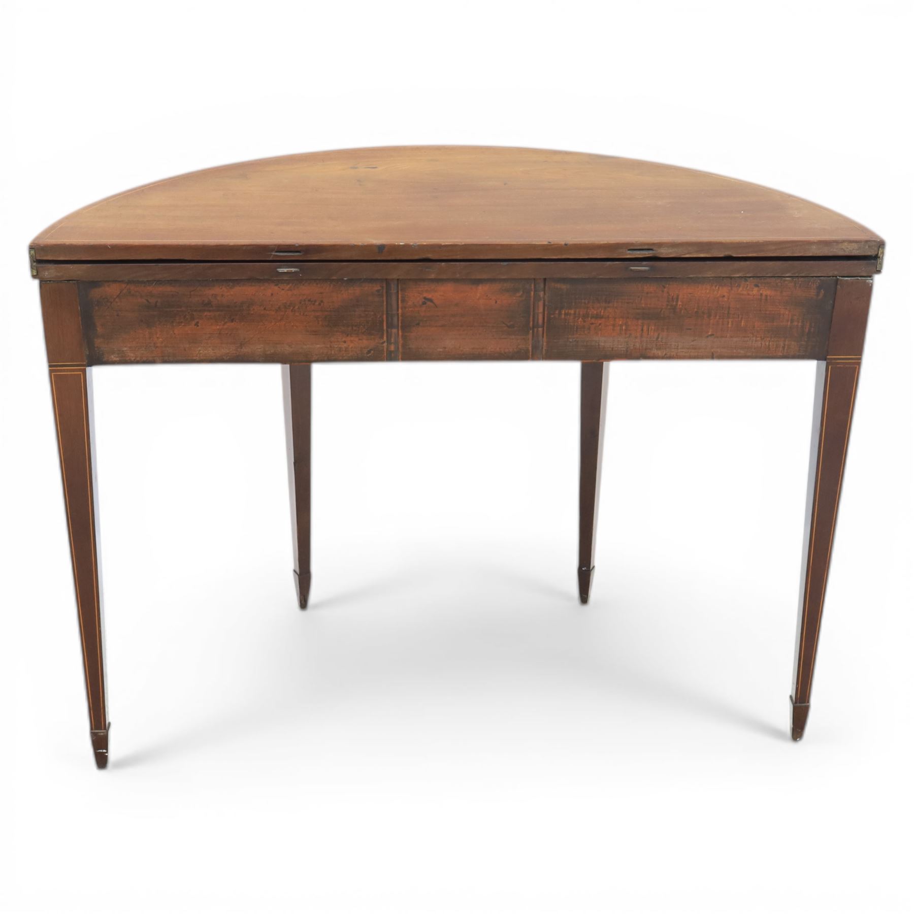 George III Scottish inlaid mahogany demi lune tea table, the curved fold over top opening to reveal a circular top with inlay to edge, above a frieze drawer with key, raised upon tapering inlaid legs with spade feet