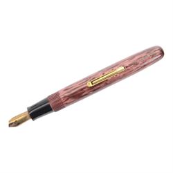 Watermans 512V fountain ped, in pink striated marble celluloid, lever filled, 14ct W-2-A nib with matching propelling pencil and a Conway Stewart No. 475 fountain pen, lever filled