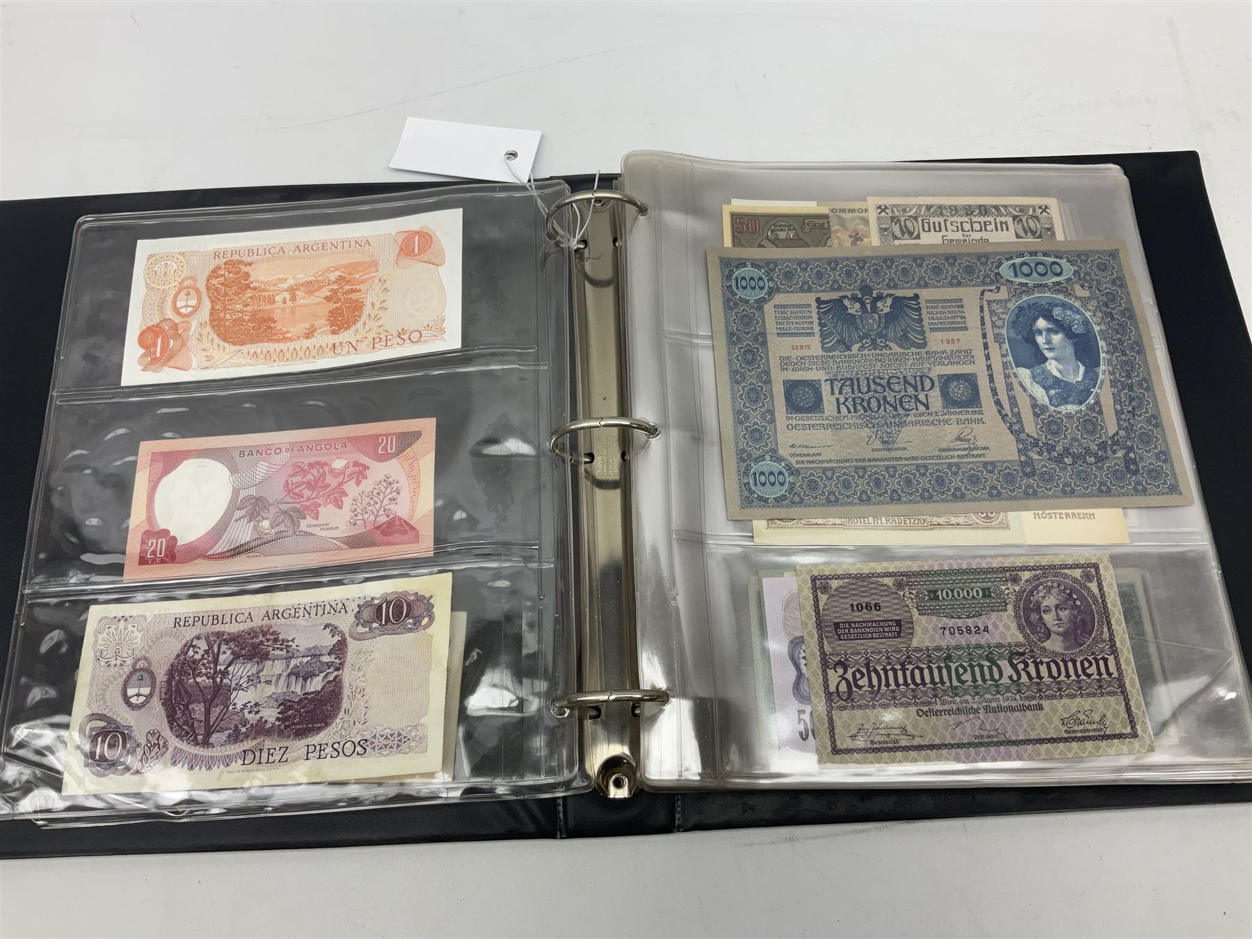 World banknotes, including Queen Elizabeth II The States of Jersey one pound 'DB202703', five pounds 'BB527762' and ten pounds 'AB651481', reserve bank of New Zealand two dollars '1L3 741894', King George V Straits Settlements one dollar 1st January 1935 'F/83 28924', various Bank of England notes etc, housed in two ring binder albums