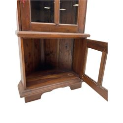Hardwood corner display cabinet, fitted with two glazed doors 