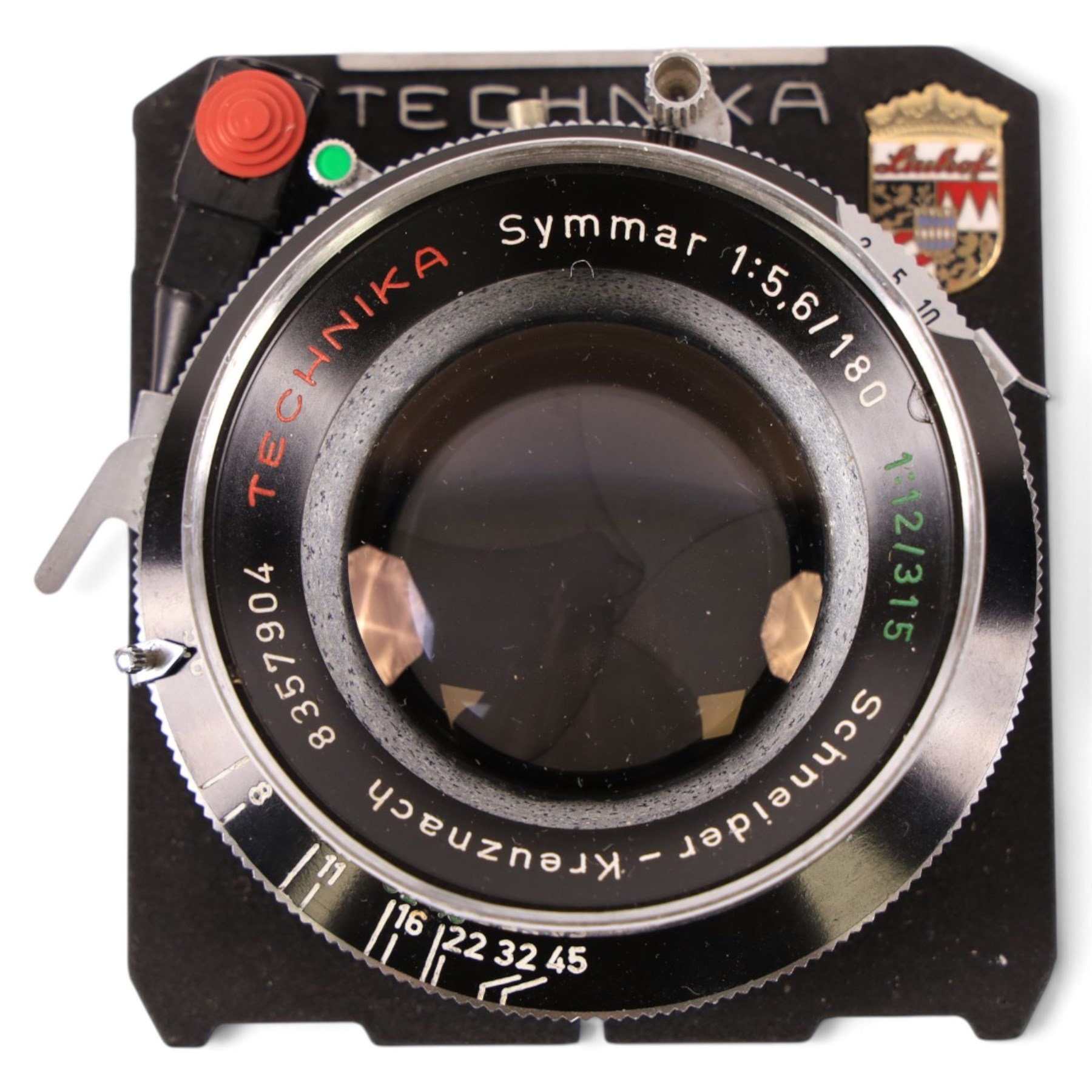 Linhof Tecnika 70 medium format press camera serial no. 1711919, with a Xenotar 1:2.8/80 lens serial no. 9254350 and a Symmar 1:5.6/180 lens serial no. 8357904, both coupled to the camera, and additional accessories including Symmar-S 5.6/100 lens, and a Carl Zeiss Jena Apo-Lanthar 40mm1:4.5 macrolens, numbered set of seven Linhof dark slides, super rollex roll film holder and anatomical grip, all contained within modern case