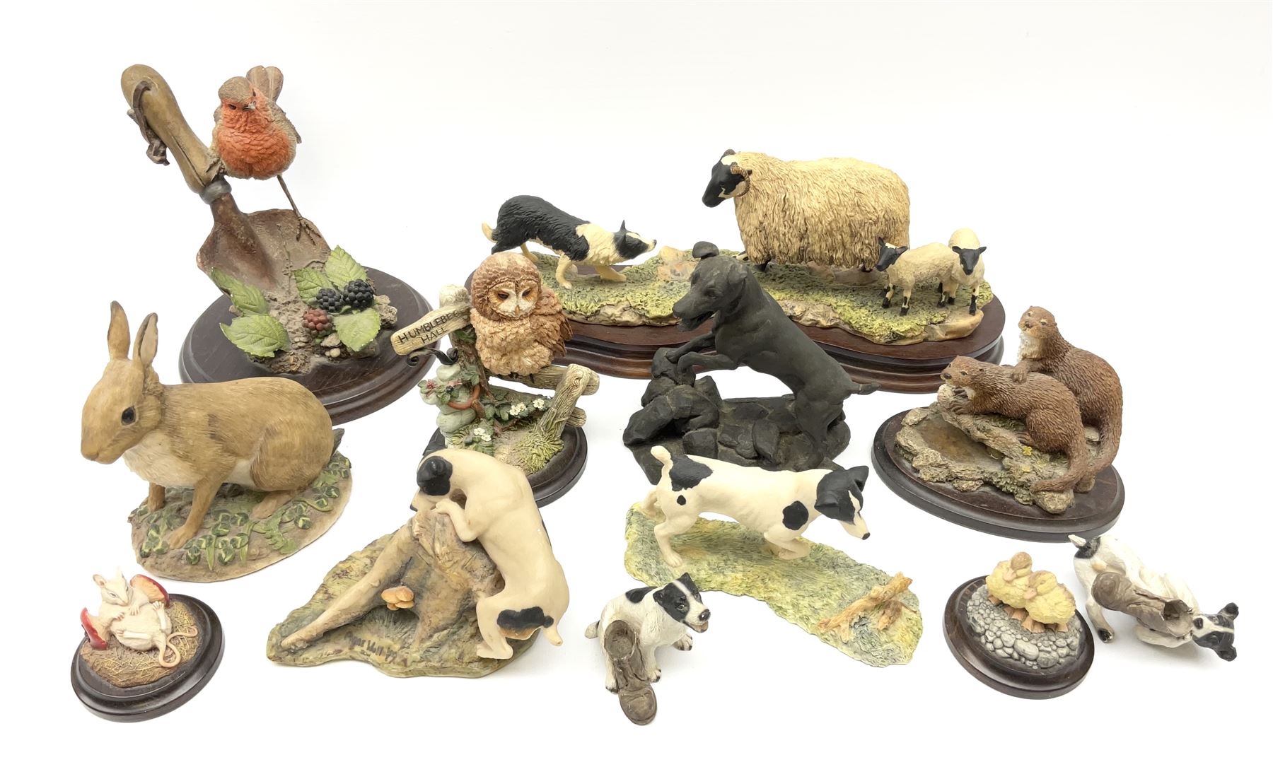 A Border Fine Arts figure, Scottish Black Faced Sheep with Collie, by Ray Ayres, on base, L30cm, together with three further Border Fine Arts figures, two examples modelled as Jack Russel Terriers, the third example modelled as a rabbit, plus a selection of other figures, including five by Country Artists, a bronze effect Heredities figure of a Jack Russel Terrier, etc.