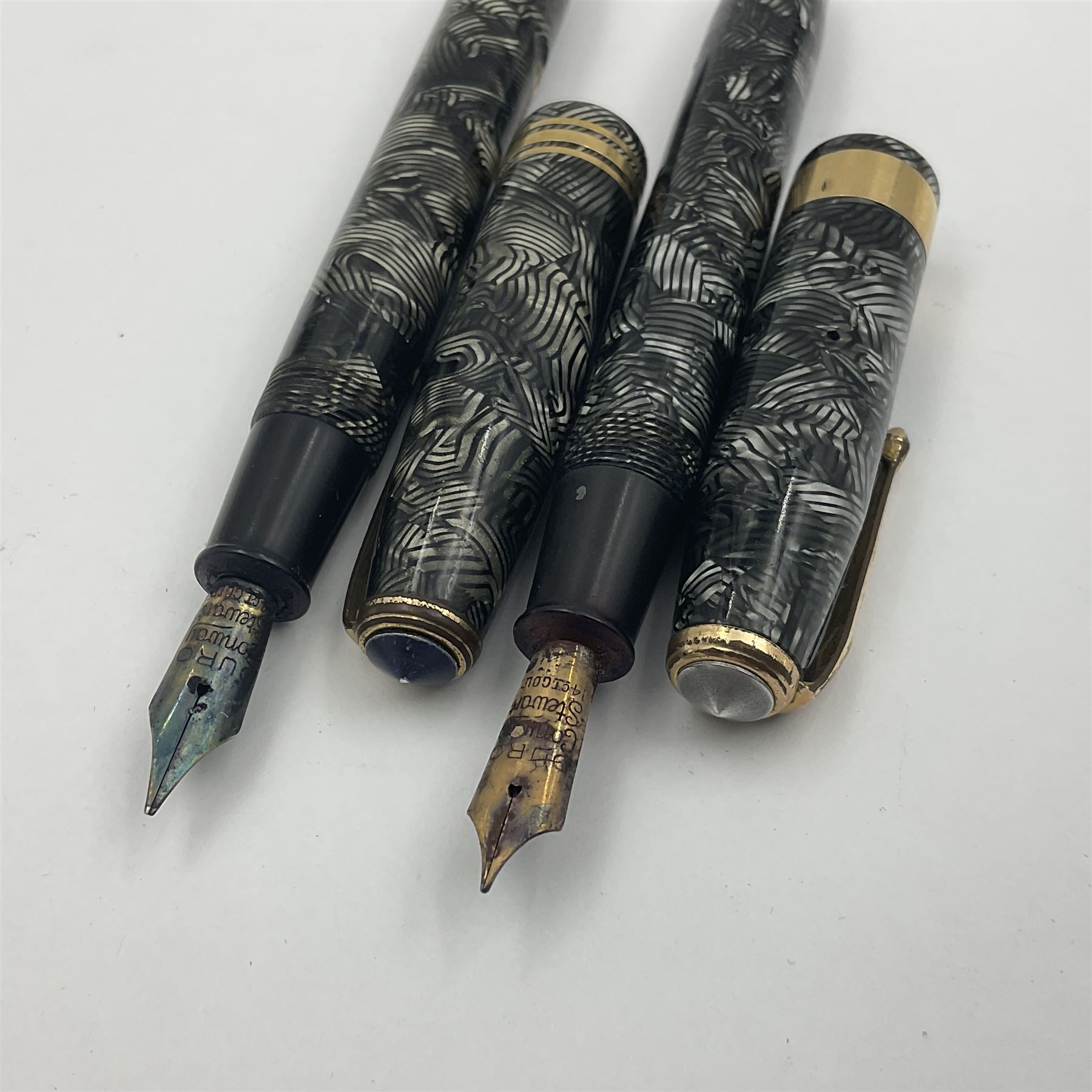 Conway Stewart Executive 60 fountain pen, the barrel and cap with hatched grey and black marble decoration and gold nib stamped Duro 14ct, together with a Conway Stewart 58 fountain pen similarly decorated in pearl blue and black with gold nib stamped 14ct, largest 13cm (2)