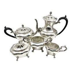 Five piece Edwardian silver tea service, comprising teapot and coffee pot, each with ebonised scroll handle, tea caddy with hinged cover, twin handled open sucrier, and milk jug, each of rounded bombe form, upon four paw feet, hallmarked William Adams Ltd, Birmingham 1904 and 1905, coffee pot H26cm
