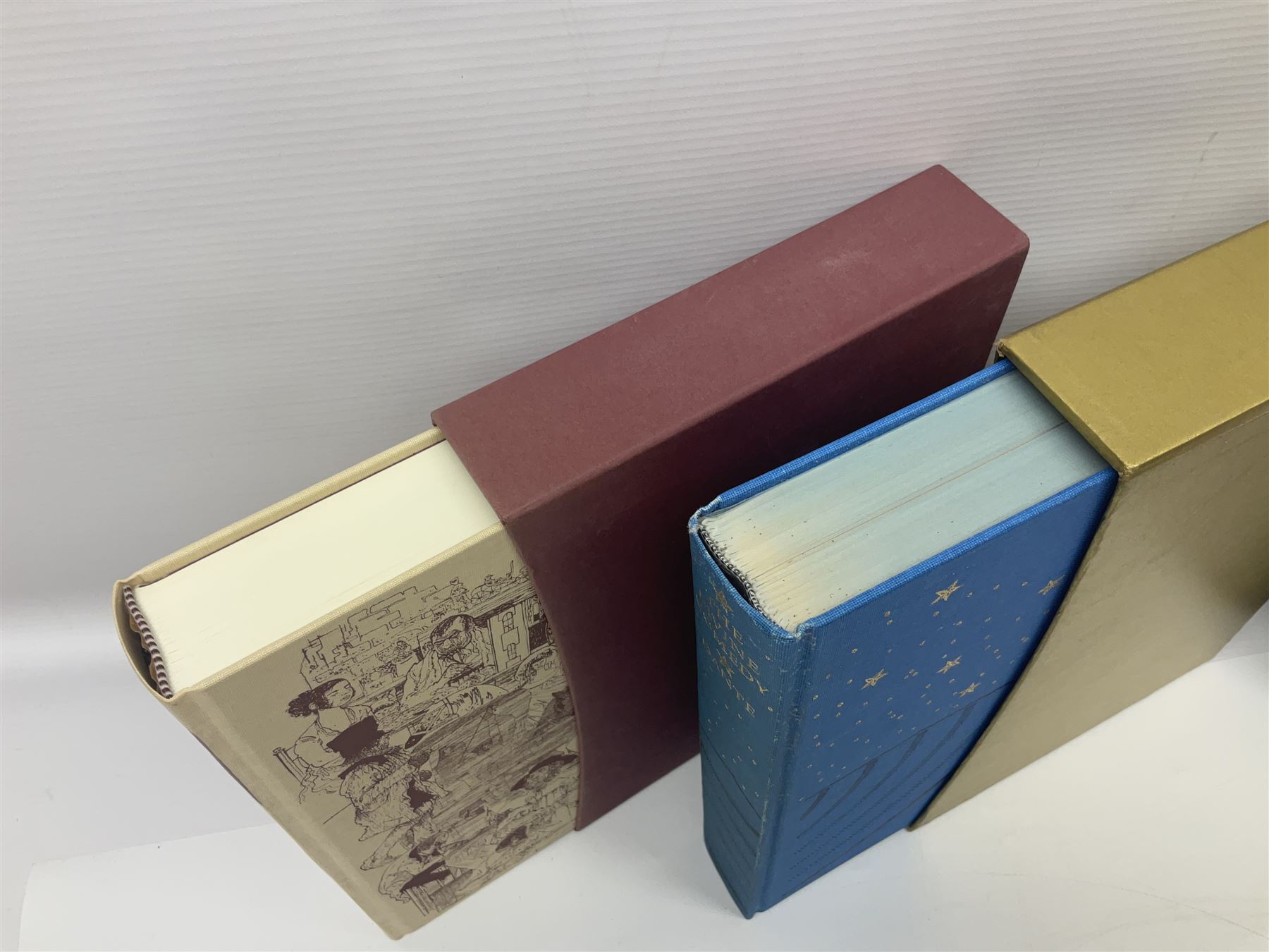 Seven Folio Society books, including The Divine Comedy, Charles Dickens Christmas Book, The Proud Tower, etc, all with outer sleeves