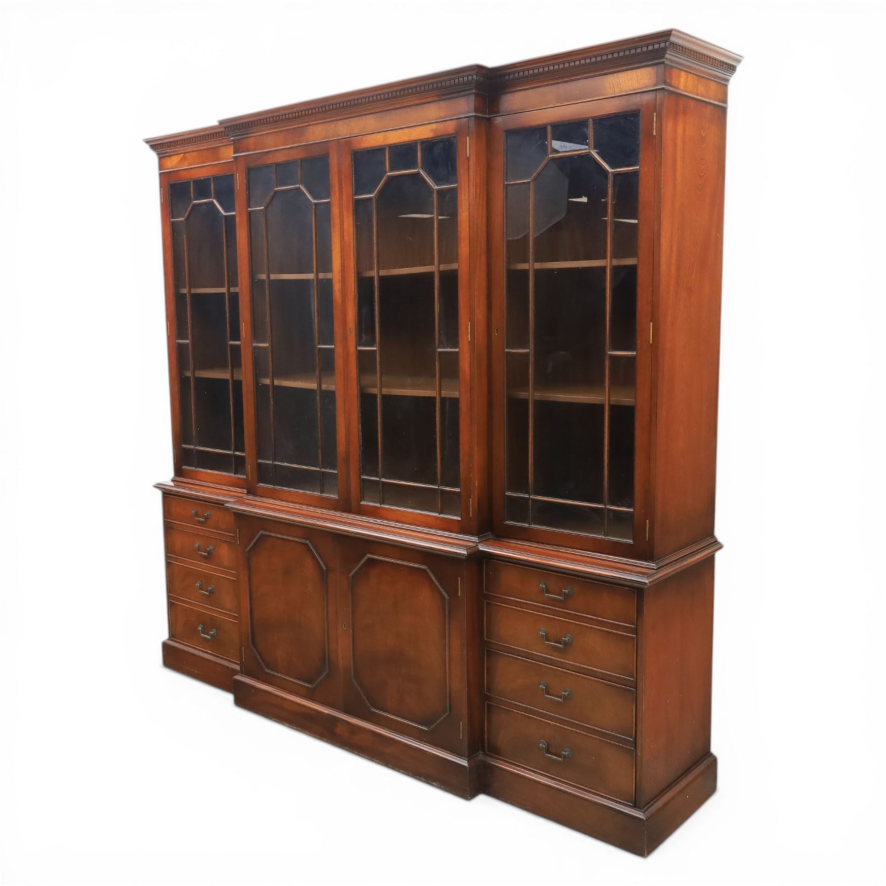 Wade Furniture - Georgian design mahogany breakfront bookcase cabinet, featuring four astragal glazed doors, above eight drawers and two cupboards, one fitted cutlery drawer