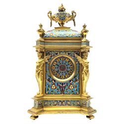 19th century French ormolu and champlevé enamel mantel clock, the twin handled urn with fruit and flower cast finial on cushion top, each corner set with urn, the front canted corners decorated with winged caryatid figures, turquoise ground champlevé work with scrolling floral pattern, twin train movement striking on bell by Japy Freres