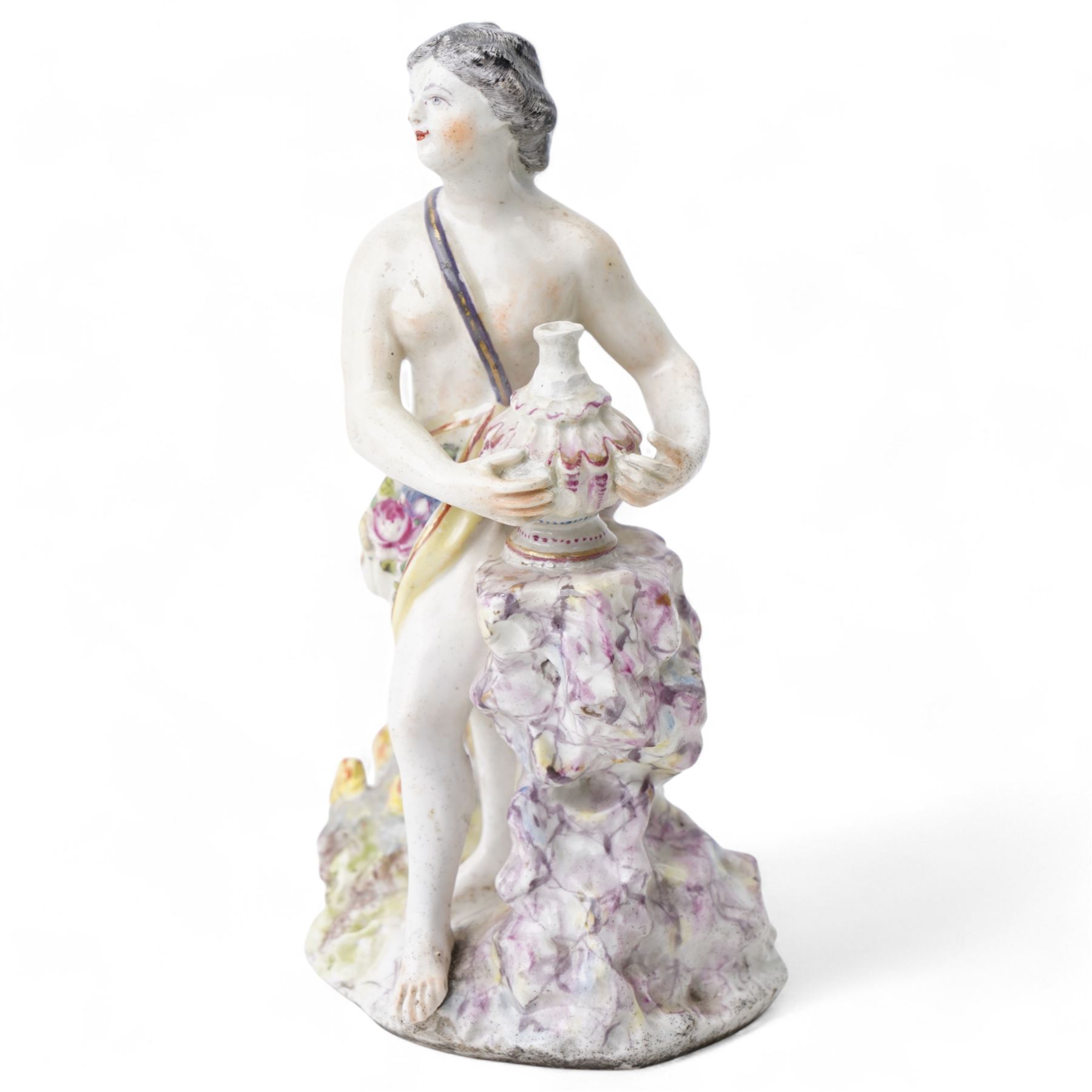 18th century possibly Staffordshire porcelain figure of Vulcan, adorned in classically draped robes, holding an urn and standing on a naturalistic base with volcanic flames H20cm