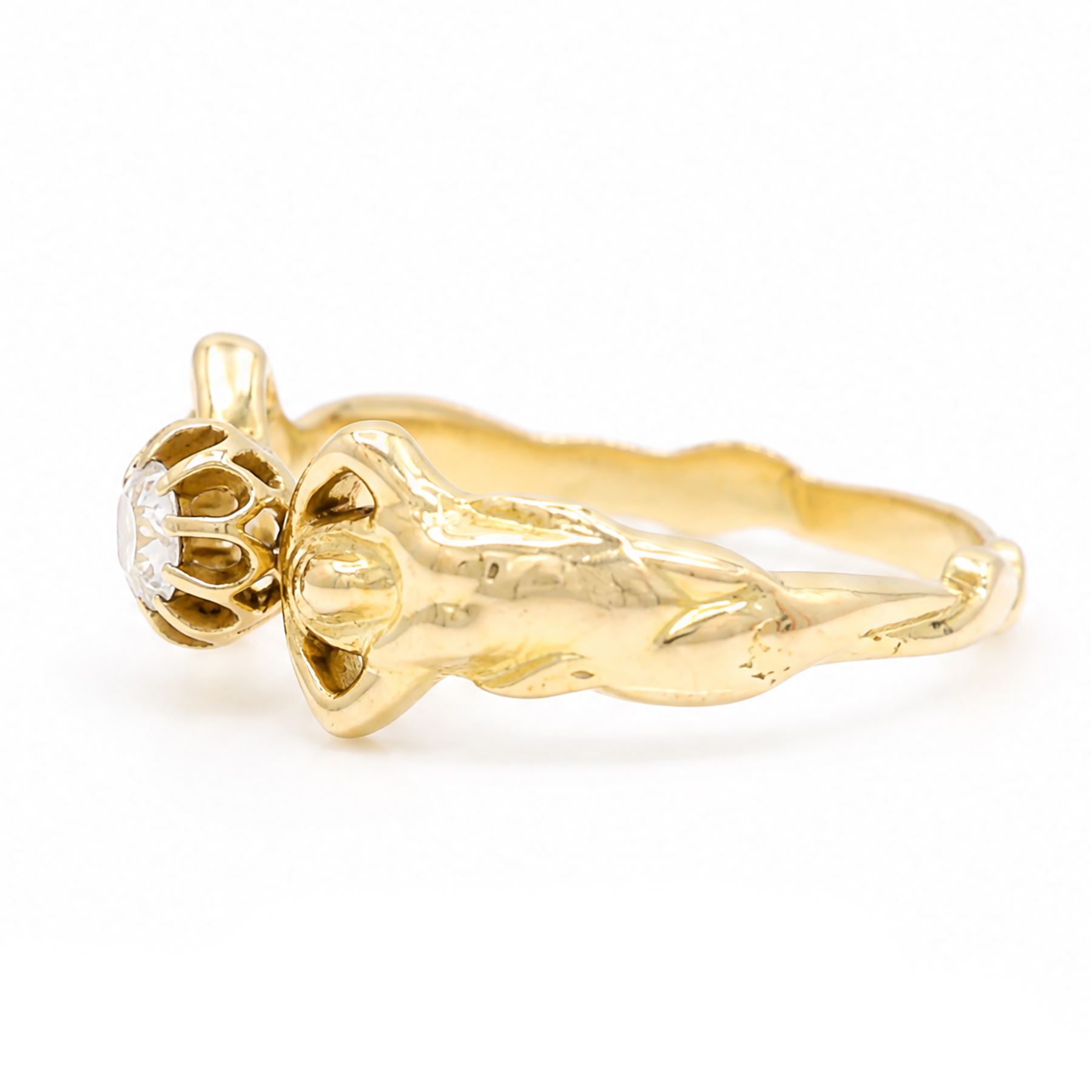 Gold diamond figural ring, single old cut diamond of approx 0.45 carat, with a nude female figure either side, stamped 18ct