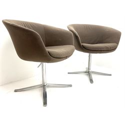 Pair Person Lloyd for Walter Knole swivel turtle chairs on polished metal supports 