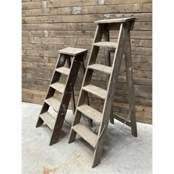 Two antique wooden step ladders, H100cm and 140cm