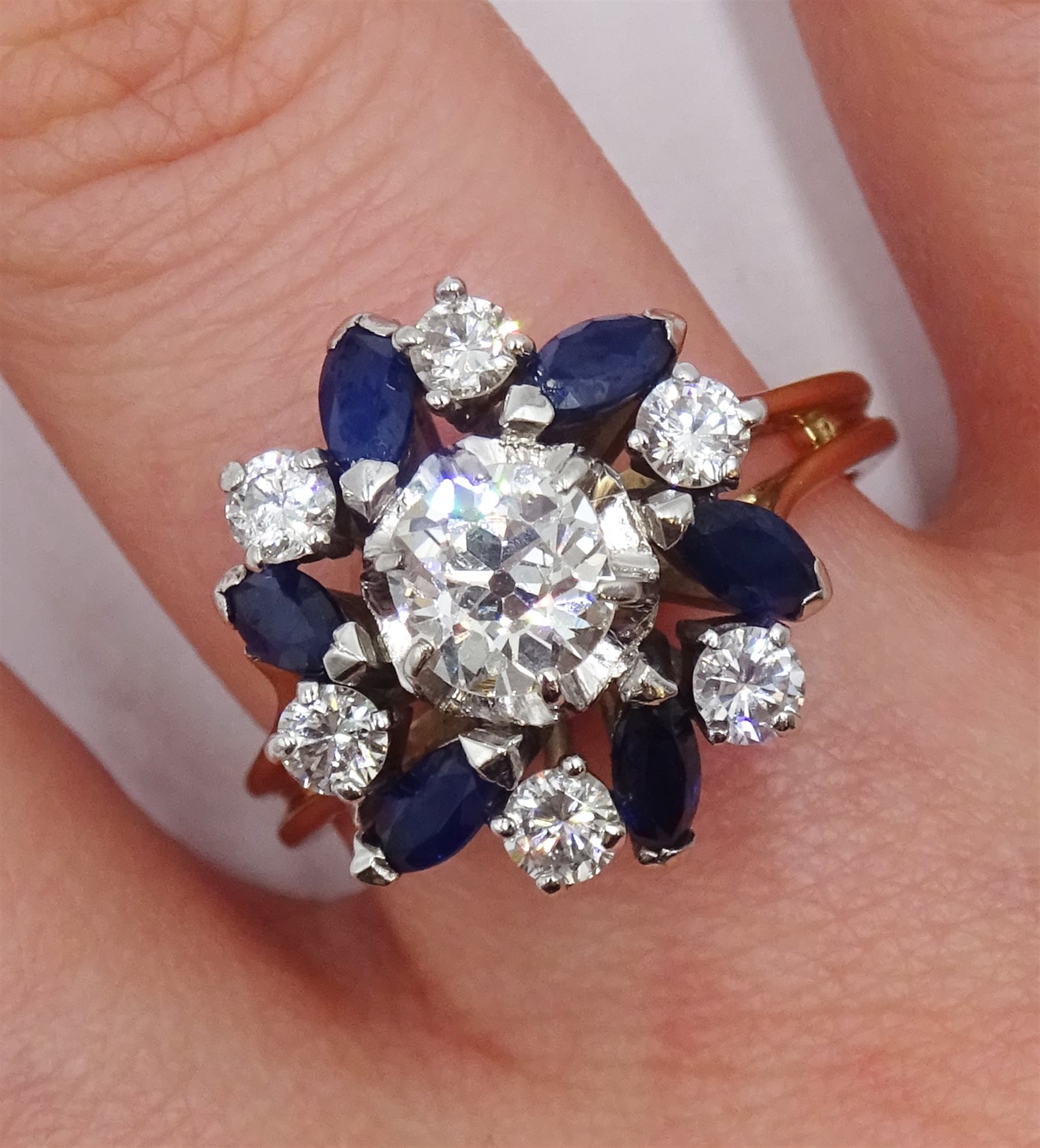18ct gold diamond and sapphire ring, the central old cut diamond of approx 0.75 carat, with round brilliant cut diamonds and marquise cut sapphires