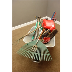  Various garden tools including forks, rakes, spade, etc... and a metal wheelbarrow   
