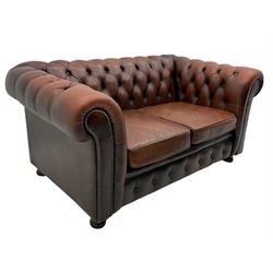 Chesterfield two seat sofa, upholstered in buttoned leather