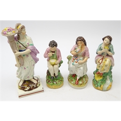  Two Victorian Staffordshire figures modelled as young girls with birds, matching figure of a young boy eating and Victorian Pearlware figure of a woman, H26cm max (4)  