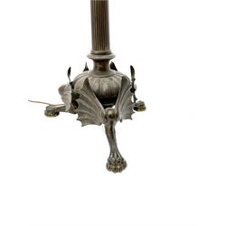 19th century heavy bronze floor standing lamp with traces of gilding, probably French, the urn shaped top on tapering reeded circular column, with central gadrooned dome to the base, supported on three bat-wing mounted paw feet