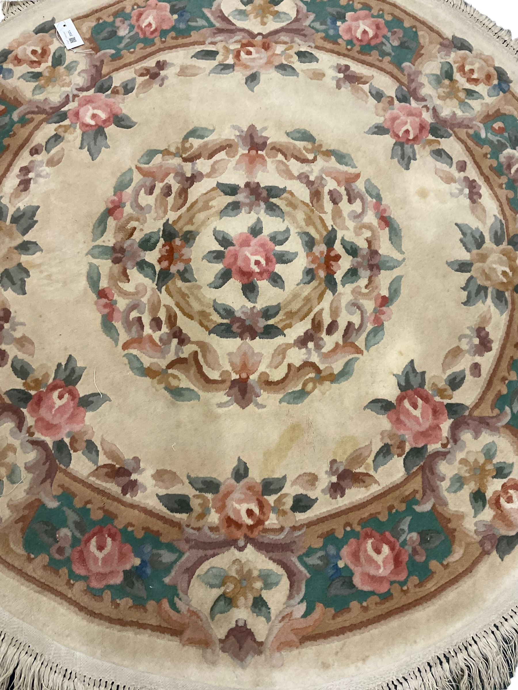 Three Chinese washed woollen rugs, circular (D143cm), rectangular