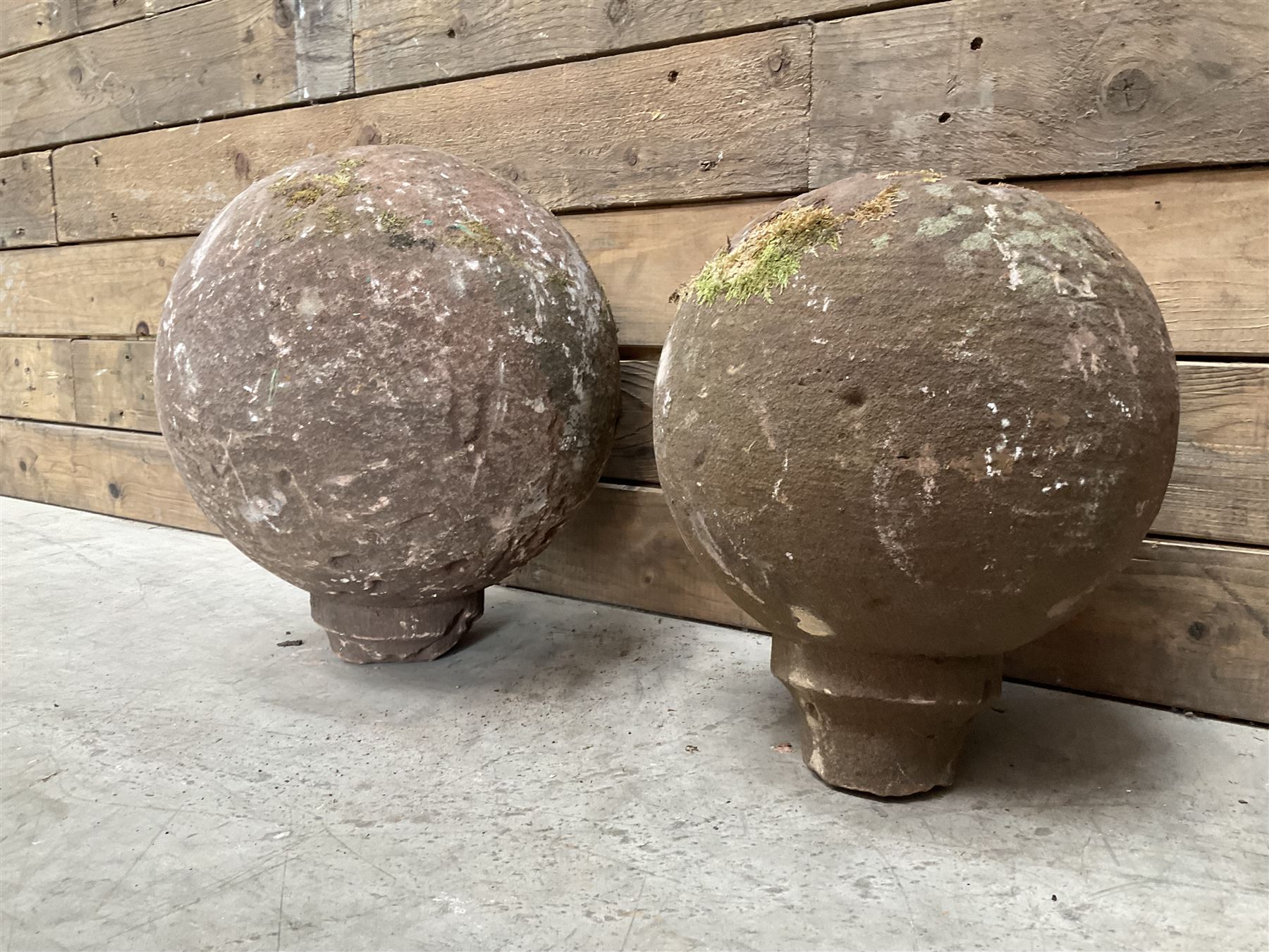 Two spherical stone gate post finials