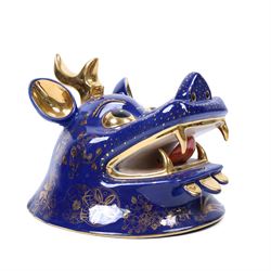 Pair of 20th century foo dog incense burners, decorated with gilt flowers and insects upon a blue ground, on wooden stands, H58cm 