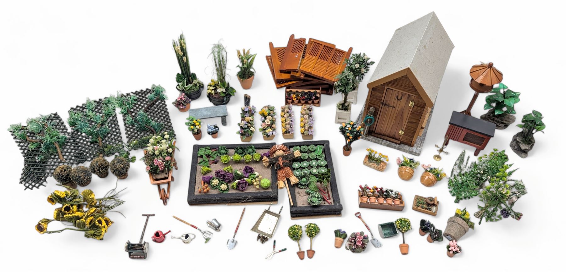 1:12 scale dolls house allotment and garden accessories, including wooden shed on a stone effect base, two vegetable patches, terracotta plant pots with flowers and foliage, stone effect plant pots, other planters, loose sunflowers, scarecrow, rabbit hutch, garden tools, fencing panels, etc 