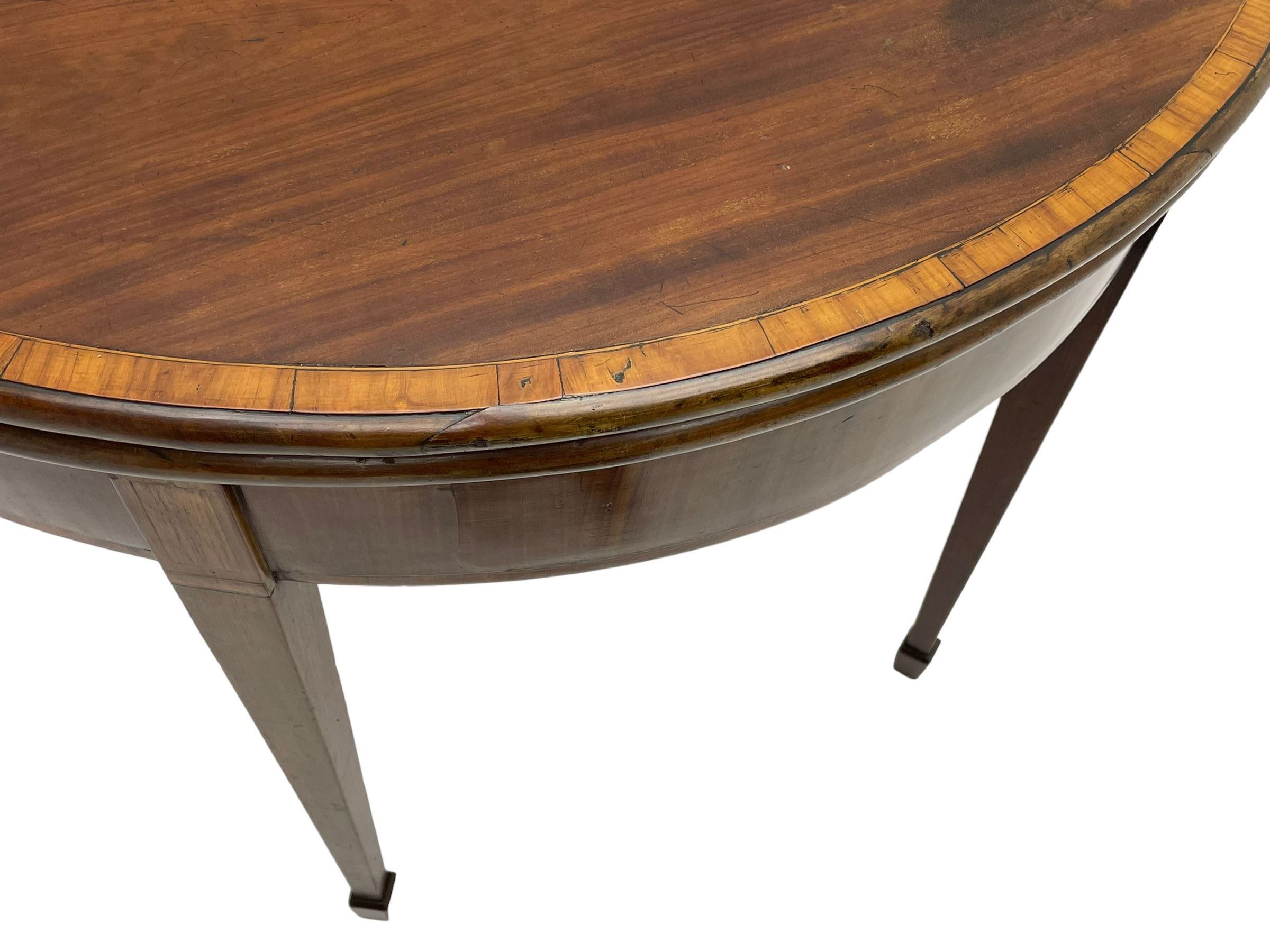 George III inlaid mahogany card table, demi-lune fold-over top with satinwood band and large fan motif, baize lined interior, double gate-leg action base, on square tapering supports with spade feet