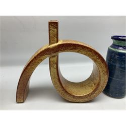 Italian mid-century Screziato studio pottery sculptural vase of faceted loop form, probably Bertoncello, painted 863 mark beneath, together with a cylindrical banded blue and green vase, largest H17.5cm W30cm
