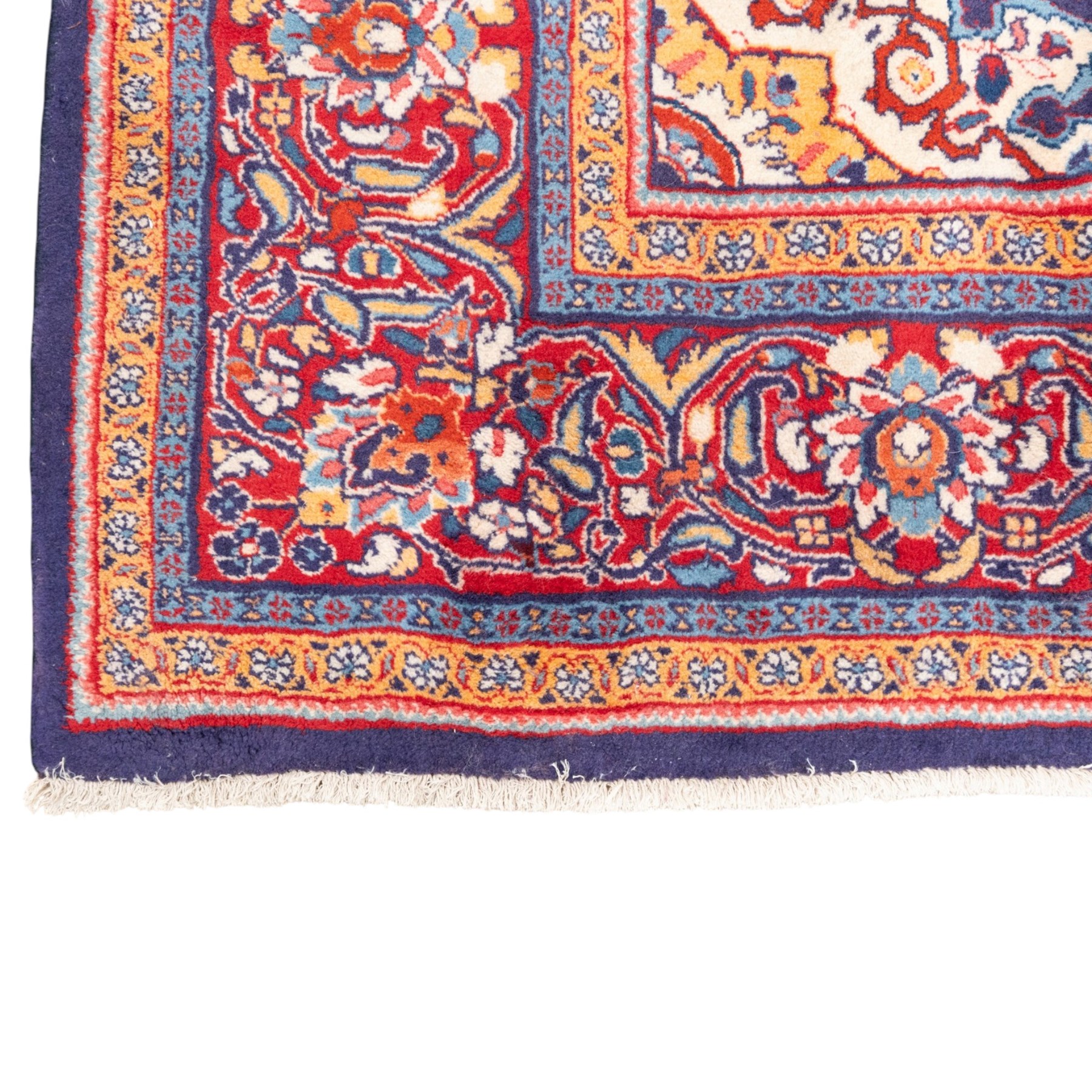 North West Persian carpet, the indigo field centred by a lobed medallion in pale blue and ochre with floral pendants, profusely decorated with scrolling foliage, palmettes and flowerheads, ivory floral spandrels, enclosed by a red ground palmette border and multiple floral guard bands