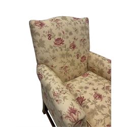 Peter Dudgeon - Georgian design mahogany framed armchair, shaped cresting rail over sprung back and seat flanked by rolled arms, upholstered in floral patterned fabric with matching seat cushion, on square supports joined by stretchers
Provenance: From the Estate of the late Dowager Lady St Oswald