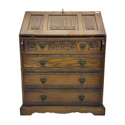 Old Charm oak bureau, fitted with fall front above four drawers